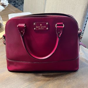 Kate Spade Dome purse with shoulder strap included. Berry color